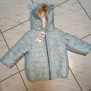 First Impressions girls zip up six to nine month coat.  Hood with little ears